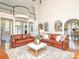 Elegant living room with hardwood floors, soaring ceilings, and comfortable leather furniture at 1700 White Pond Ln, Waxhaw, NC 28173