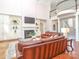 Spacious living room with built-in shelves, fireplace, and a stunning balcony view at 1700 White Pond Ln, Waxhaw, NC 28173