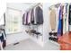 Spacious walk-in closet with plenty of hanging space and shelving for organization at 1700 White Pond Ln, Waxhaw, NC 28173