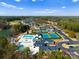 Stunning aerial view of the community amenities, including a pool, tennis courts, and golf course at 1717 Brawley School Rd, Mooresville, NC 28117