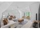 Large bonus room with seating area, foosball table, neutral tones, and lots of natural light at 1717 Brawley School Rd, Mooresville, NC 28117