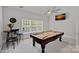 Game room featuring a billiards table, window, and casual seating area at 1717 Brawley School Rd, Mooresville, NC 28117