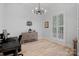 Well-lit office space featuring a large arched window and a decorative cabinet at 1717 Brawley School Rd, Mooresville, NC 28117