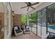 Outdoor screened porch featuring lounge seating with backyard views of the pool and outdoor space at 1717 Brawley School Rd, Mooresville, NC 28117