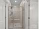 Shower with tile surround, glass door, and two entry points at 1717 Brawley School Rd, Mooresville, NC 28117