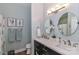 This bathroom features double sinks, modern fixtures, and blue accent towels at 18832 Nautical Dr # 41, Cornelius, NC 28031