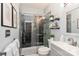 This bathroom features a shower with dark tiling, a glass door, and floating shelves at 18832 Nautical Dr # 41, Cornelius, NC 28031