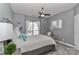 This bedroom features a ceiling fan, carpet, and large windows with lots of light at 18832 Nautical Dr # 41, Cornelius, NC 28031