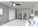 This bedroom features a ceiling fan, a dresser, and an ensuite bathroom at 18832 Nautical Dr # 41, Cornelius, NC 28031