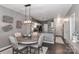 Dining area with modern light fixture, round table, and four chairs in an open layout at 18832 Nautical Dr # 41, Cornelius, NC 28031