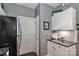This kitchen features white cabinets, subway tile backsplash, and dark granite countertops at 18832 Nautical Dr # 41, Cornelius, NC 28031