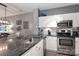 Modern kitchen features stainless appliances, white cabinetry, and granite countertops at 18832 Nautical Dr # 41, Cornelius, NC 28031