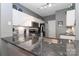 This kitchen features stainless appliances, white cabinets, granite countertops, and a modern faucet at 18832 Nautical Dr # 41, Cornelius, NC 28031
