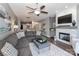 Comfortable living room features plush sectional sofa, fireplace, and open floorplan at 18832 Nautical Dr # 41, Cornelius, NC 28031