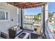 Charming patio features wicker seating, wooden pergola, and scenic waterfront view at 18832 Nautical Dr # 41, Cornelius, NC 28031