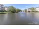 Scenic waterfront view featuring a lake with decorative fountains at 18832 Nautical Dr # 41, Cornelius, NC 28031
