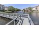 Peaceful waterfront view with a walking bridge and fountain at 18832 Nautical Dr # 41, Cornelius, NC 28031