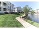 Scenic view of waterfront property with lush green lawn and well-maintained landscaping at 18832 Nautical Dr # 41, Cornelius, NC 28031