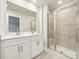 Modern bathroom featuring a double vanity and a glass-enclosed shower at 1930 Old Rivers Rd, Concord, NC 28027