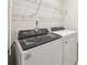 Laundry room with modern washer and dryer and a wire shelf at 1930 Old Rivers Rd, Concord, NC 28027