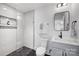 Modern bathroom featuring black and white tiles, a glass shower, a framed mirror, and a sleek vanity at 2027 Thurmond Pl, Charlotte, NC 28205