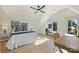 Bedroom with a bed and desk in a well-lit room with a window seat and hardwood floors at 2027 Thurmond Pl, Charlotte, NC 28205