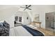 Bright bedroom with vaulted ceilings, hardwood floors, a bed with blue accents and a window seat at 2027 Thurmond Pl, Charlotte, NC 28205