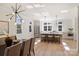 Inviting kitchen and dining space with modern lighting, stainless steel appliances, and a seamless design for entertaining at 2027 Thurmond Pl, Charlotte, NC 28205
