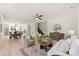 Bright living room with hardwood floors, open layout, flowing into the dining area and modern kitchen at 2027 Thurmond Pl, Charlotte, NC 28205