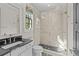 Bright bathroom featuring a glass-enclosed shower and stylish fixtures; a tranquil and modern space at 2137 Foxcroft Woods Ln, Charlotte, NC 28211