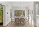 Elegant dining room with large windows and a stylish light fixture, creating a welcoming atmosphere at 2137 Foxcroft Woods Ln, Charlotte, NC 28211