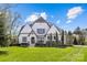 Charming two-story home with manicured lawn and inviting facade, a perfect blend of comfort and curb appeal at 2137 Foxcroft Woods Ln, Charlotte, NC 28211