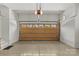 Clean and organized garage interior featuring a polished floor, natural light, and well-maintained door at 2137 Foxcroft Woods Ln, Charlotte, NC 28211