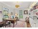 Classic home office featuring a wooden desk, bookshelves, and natural light for a productive workspace at 2137 Foxcroft Woods Ln, Charlotte, NC 28211