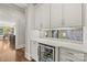 Convenient bar area with custom cabinets and wine cooler at 2137 Foxcroft Woods Ln, Charlotte, NC 28211