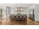 Spacious kitchen boasts an island, stainless steel refrigerator, and ample storage space in custom cabinetry at 2137 Foxcroft Woods Ln, Charlotte, NC 28211