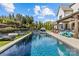 Stunning backyard pool with ample seating and lush landscaping, perfect for relaxing and entertaining at 2137 Foxcroft Woods Ln, Charlotte, NC 28211