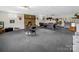 Spacious finished basement area with a fireplace, pool table, and a bar at 2251 Old Applewood Ln # 9, Iron Station, NC 28080