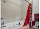 Bathroom featuring a bathtub with jets and a shower with red decorative curtain at 2251 Old Applewood Ln # 9, Iron Station, NC 28080