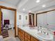 Bathroom boasting double sinks, wood cabinets, a large mirror and ample lighting at 2251 Old Applewood Ln # 9, Iron Station, NC 28080