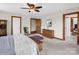 The bedroom features a wooden dresser, a comfortable bed, and natural light from the windows at 2251 Old Applewood Ln # 9, Iron Station, NC 28080