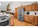 A traditional kitchen featuring wood cabinets, stainless steel appliances, and eat-in counter at 2251 Old Applewood Ln # 9, Iron Station, NC 28080
