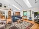Spacious living room with hardwood floors, skylights, and plenty of natural light at 2251 Old Applewood Ln # 9, Iron Station, NC 28080