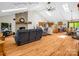 Bright and airy living room featuring a brick fireplace, skylights, and open floor plan at 2251 Old Applewood Ln # 9, Iron Station, NC 28080