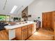 Bright office nook featuring a built-in desk, skylight and adjacent to the living area at 2251 Old Applewood Ln # 9, Iron Station, NC 28080