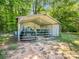 Enclosed metal storage shed with farm equipment on a landscaped lot ready for animals and outdoor activities at 2251 Old Applewood Ln # 9, Iron Station, NC 28080