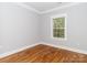 Cozy bedroom with hardwood floors and a large window for natural light at 2302 Jordi Way, Charlotte, NC 28213