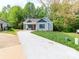 Charming single-Gathering home with a concrete driveway and well-manicured lawn at 2302 Jordi Way, Charlotte, NC 28213