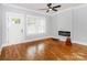 Bright living room with hardwood floors, modern fireplace, and ample natural light at 2302 Jordi Way, Charlotte, NC 28213