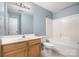 This bathroom features a white sink and vanity, and a shower and tub combo at 248 Pangle Dr, Charlotte, NC 28217